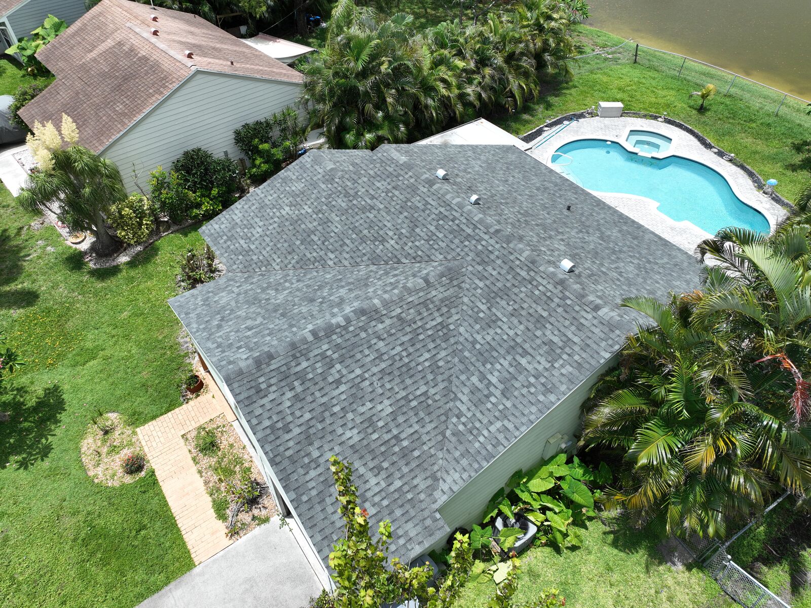 Residential shingle roof replacement with pool
