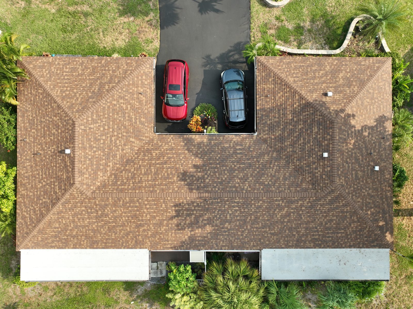 Completed shingle roof replacement on a family home