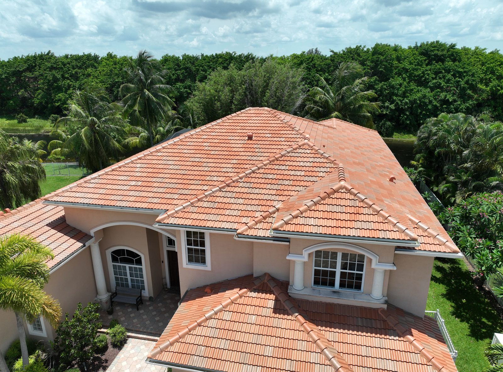 Concrete tile roof replacement with hip roof design