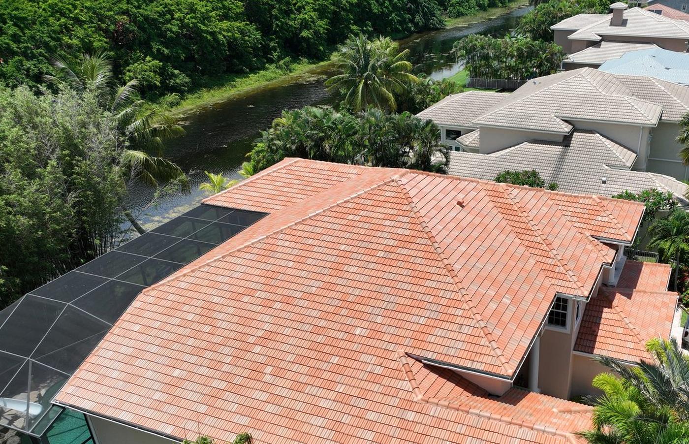 New barrel tile roof installed by Ron Bell Roofing on a waterfront home in Palm Beach County